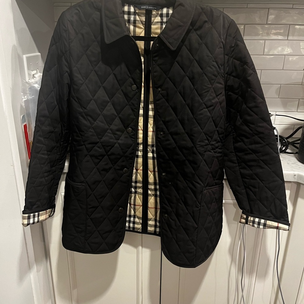 Authentic Burberry black snap closed quilted coat NWOT.